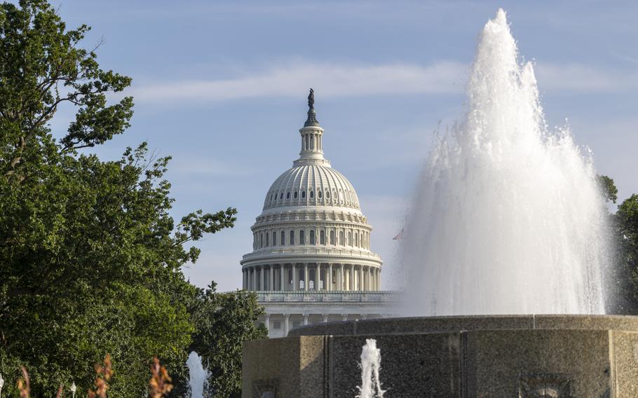 A fountain spouts with the Capitol dome in the background.