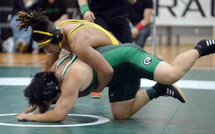 Kadena 189-pounder Tre Shears takes down Kubasaki's Erich Aquino during Wednesday's Okinawa wrestling dual meet. Shears pinned Aquino in 1 minute, 22 seconds and the Panthers won the meet 34-28 to go 4-0 over the Dragons on the season.