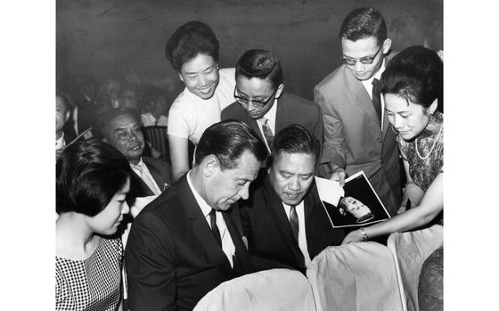 Taipei, Taiwan, June 15, 1965: Actor William Holden signs autographs while attending the 11th Asian Film Festival held this year for the first time in Taiwan at the Taipei Sports and Cultural Center in Taipei. The festival was attended by more than 200 film stars, technicians and executives from Japan, Taiwan, Hong Kong, Malaysia, Thailand, South Vietnam and the Philippines. The American actor - whose film The Seventh Dawn was one of the guest entries at the festival and received a special citation - arrived at the festival at the last minute, coming from location in Singapore. 

Looking for Stars and Stripes’ historic coverage? Subscribe to Stars and Stripes’ historic newspaper archive! We have digitized our 1948-1999 European and Pacific editions, as well as several of our WWII editions and made them available online through https://starsandstripes.newspaperarchive.com/

META TAGS: Pacific; Taiwan; entertainment; celebrity; actors; film industry; Asian culture; fans; autograph; festival
