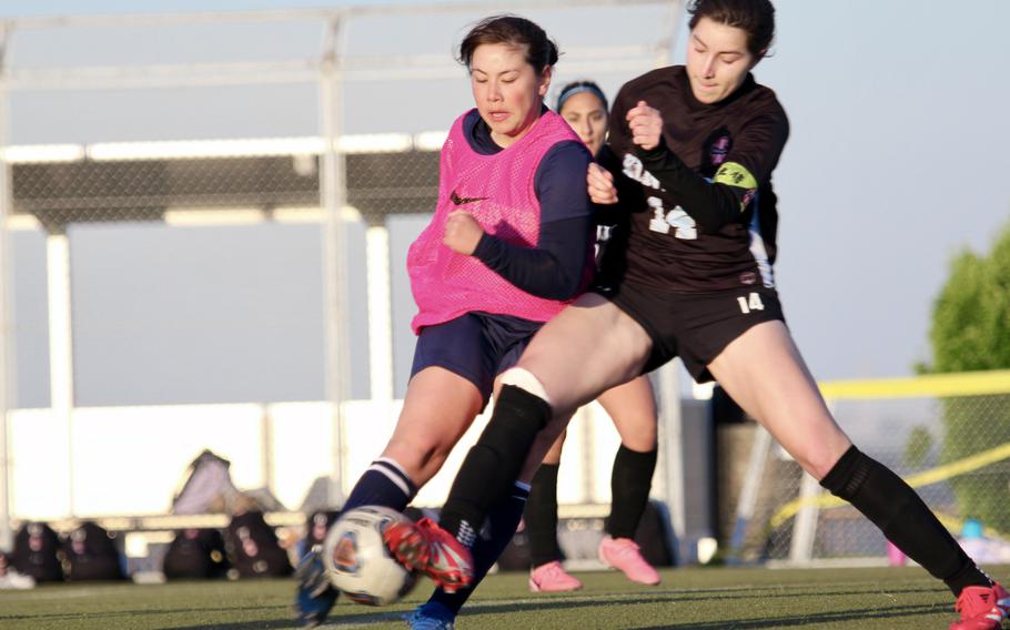 Misaki Matsuoka and Giovanna Kennedy battle for the ball.