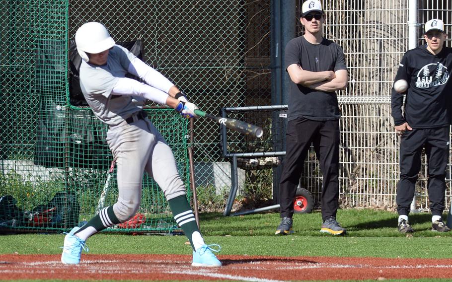 Kubasaki's Asher Romnek launches an RBI single during Friday's 14-7 loss to American School In Japan.