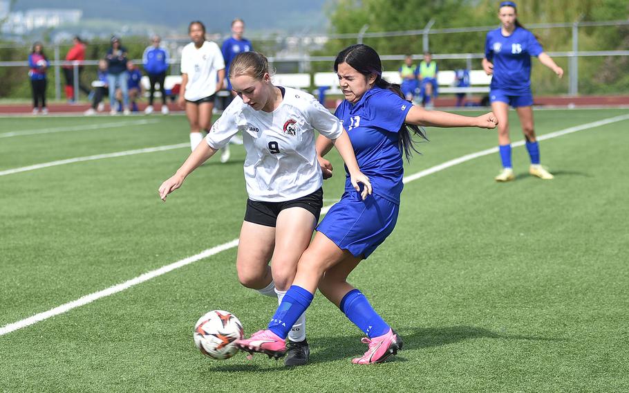 Emily Arocan pokes the ball away.