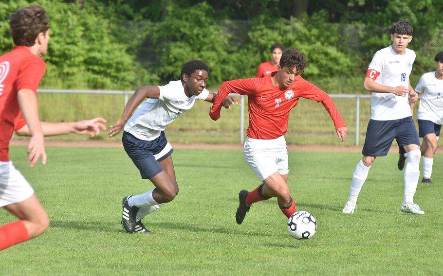 Marymount's Emmanuel Onuzulike tries to chase down American Overseas School of Rome's Lorenzo Di Gregorio on Tuesday, May 17, 2022, at the DODEA-Europe boys Division II soccer tournament in Landstuhl, Germany.
