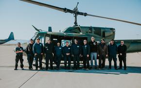 Kirtland AFB 58th Special Operations Wing Flight Line Mechanics post for a group photo with the UH-1N helicopter that crossed the 20,000 flight hours milestone on March 22, 2024. The UH-1N Hueys were initially designed to be 4,000 hour aircrafts but continue to serve the air crew and the mission due to their robust design and adaptations.