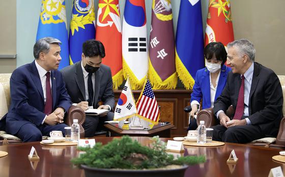 U.S. Ambassador to South Korea Philip Goldberg, right, speaks to South Korean Minister of National Defense Lee Jong-sup at the ministry's headquarters in Seoul, South Korea, July 21, 2022.