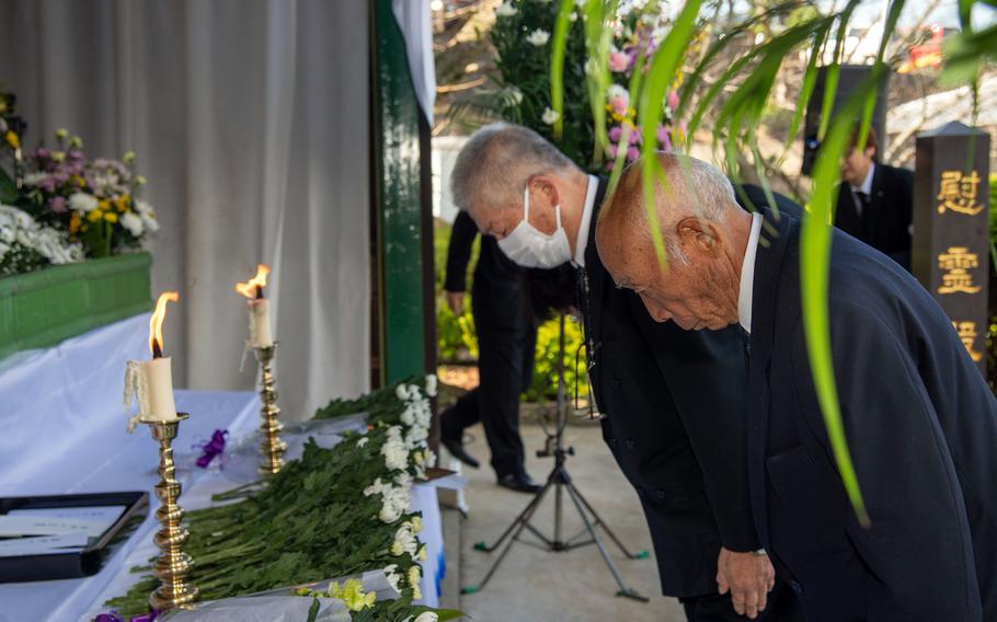 People bow during a memorial ceremony at Higashiyama Park Cemetery on Oct. 28 to honor Sasebo citizens who died in World War II.