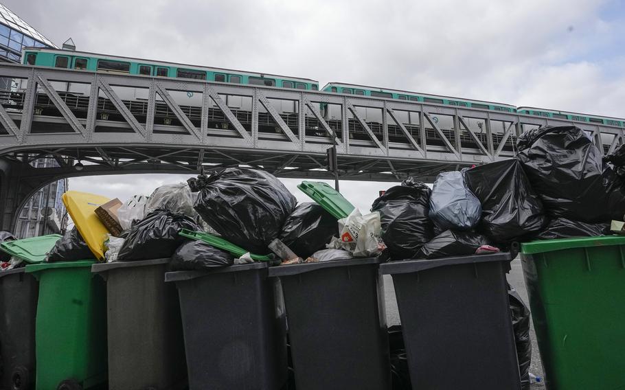 Cans full of garbage that did not get picked up in Paris, March 12, 2023. 