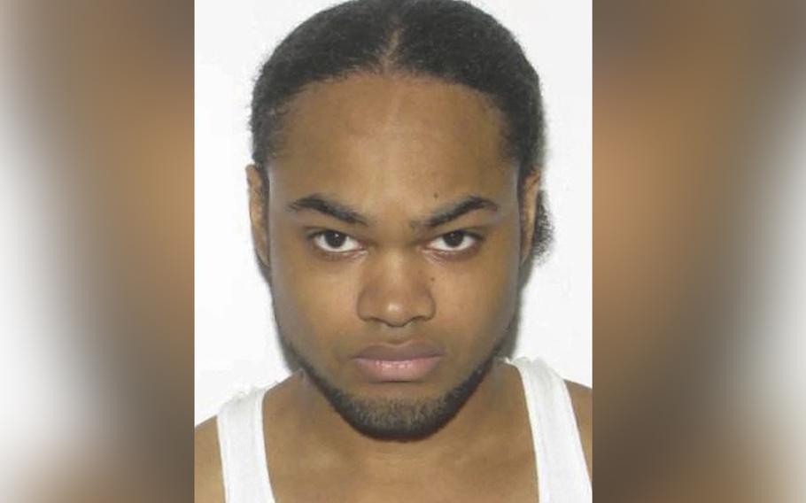 A photo illustration shows a police mug shot of Andre Bing, the gunman who shot and killed six people at a Chesapeake, Va., Walmart.