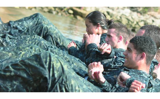 Annapolis, Maryland, May 11, 2015: Plebes participate in the “wet and sandy” portion of the U.S. Naval Academy’s annual Sea Trials in Annapolis, Md. The Sea Trials are a fourteen hour rigorous physical and mental endurance test in which the Academy's freshmen class of midshipmen - also know as Plebes - prove they have what it takes.

META TAGS: U.S. Navy; Sea Trials; training; military eductation; Naval Academy; 