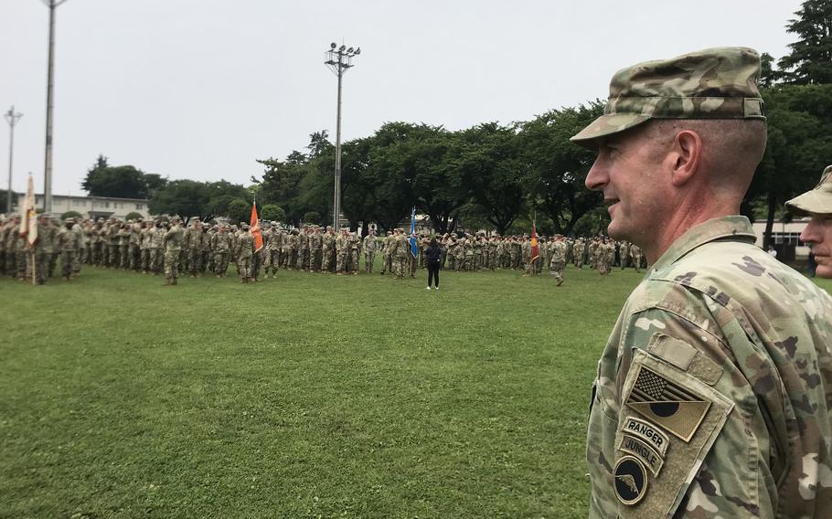 U.S. Army Japan commander Maj. Gen. Joel Vowell wears a new patch that combines the U.S. and Japanese flags during a formation at Camp Zama, Japan, on June 17, 2022. 