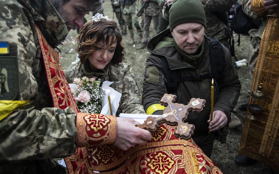 Lesya Filimonova and Valeriy Filimonov are wedded close to the front line in Kyiv on Sunday, March 6, 2022. 