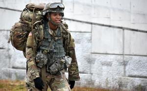Spc. Brooke Hendricks, a saxophonist for the U.S. Army Japan Band, competes in the 12-mile ruck march during a Best Warrior competition at Sagami General Depot, Japan, May 13, 2021. Hendricks came in first in the event’s soldier category. 