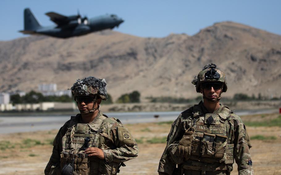 Two paratroopers assigned to the 1st Brigade Combat Team, 82nd Airborne Division conduct security while a C-130 Hercules takes off in Kabul, Afghanistan, in 2021. The Biden administration’s new security strategy document deemphasizes the Middle East and Afghanistan. 