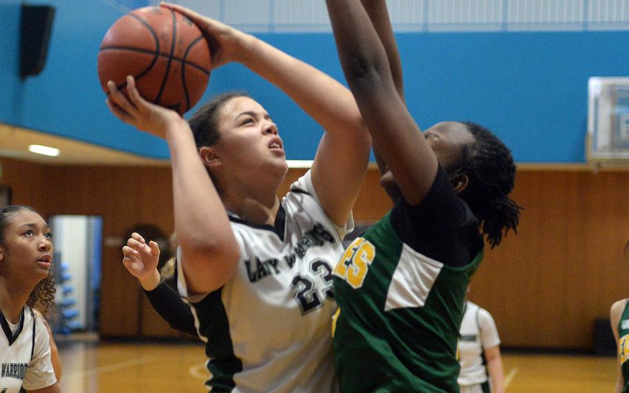 Daegu's Jasmine Harvey shoots against Edgren's Aniah Cain during Tuesday's 40-38 comeback win by the Warriors in the Girls Division II knockout round.