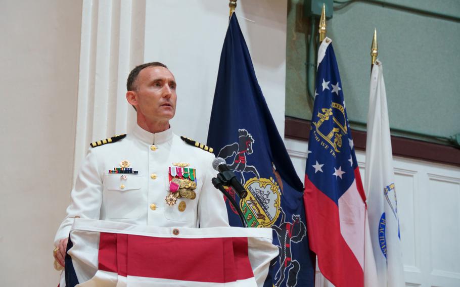 Capt. Rich Jarrett, outgoing commander of Yokosuka Naval Base, Japan, speaks during his change-of-command ceremony at the base theater, Friday, July 8, 2022. 