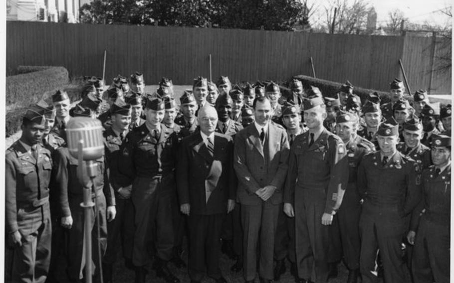 President Harry S. Truman (front row, fifth from right) and Secretary of the Army Frank Pace (front row, fourth from right) with members of the integrated 82nd Airborne in the Rose Garden behind the White House in February, 1951. 