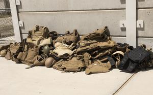 Body armor and helmets belonging to U.S. Embassy staff lay discarded at Kabul’s military airport, as the staff evacuate Afghanistan on Aug. 15, 2021. 