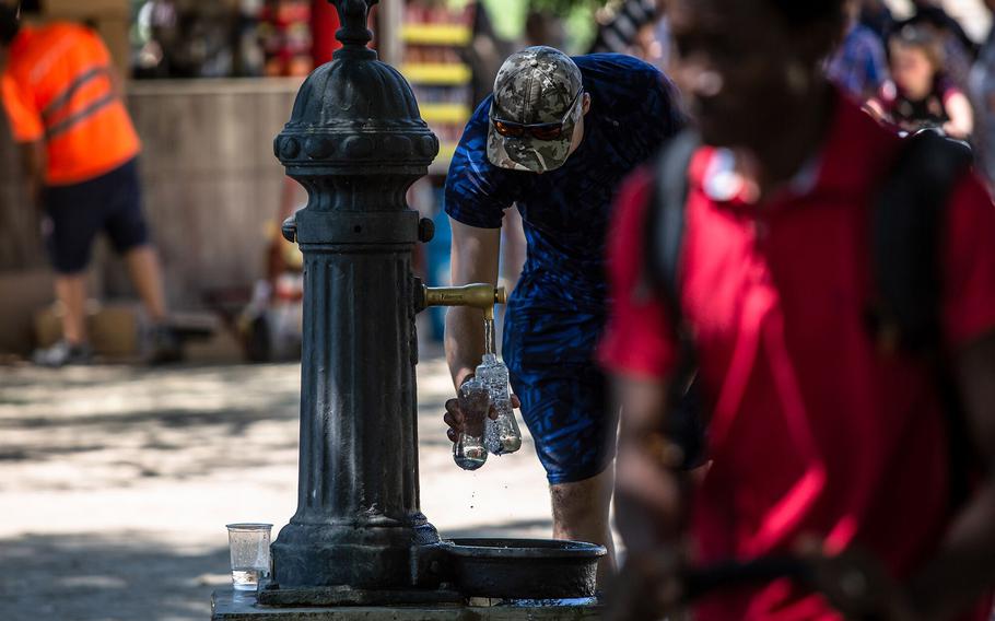 A visitor refills water bottles at a drinking fountain at Ciutadella Park, a designated climatic refuge, part of Barcelona’s Climate Shelter Network (CSN), where residents can take shelter during extreme heat, in Barcelona. A growing population and rising temperatures will strain the world’s freshwater supplies over the next 30 years, jeopardizing available water for drinking, bathing and growing food, according to new research.