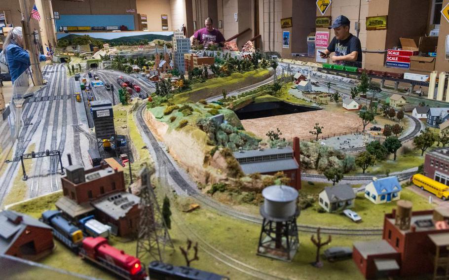 People at a Associated Model Railroads of Columbia meeting March 20 look at a model railroad. 