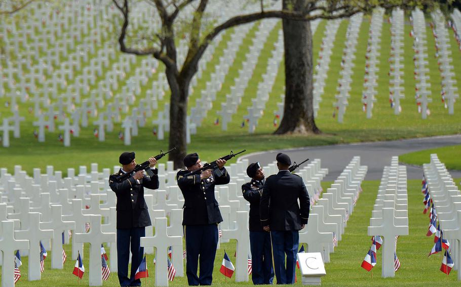 A firing team from the 2nd Cavalry Regiment out of Vilseck, Germany, fires volleys at the Memorial Day Ceremony at Lorraine American Cemetery in St. Avold, France, Sunday, May 26, 2019. 

