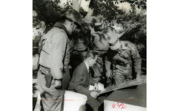 50 miles north of Seoul, South Korea, Oct. 1959: Republic of Korea House Speaker Ki Poong Lee is briefed by Lt. Gen. Jae Hung Yu, First Republic of Korea Army commander on Operation Killing Zone. The exercise deployed 50,000 troops in a maneuver conducted under simulated atomic conditions.  Held 50 miles north of Seoul it was a test of combat effectiveness during a chemical, biological and radiological war. The operation included mobile, attack and defense operations. Elements of the ROK Air Force and U.S. Army’s 4th Missile Command acted as supporting units.

Looking for Stars and Stripes’ historic coverage? Subscribe to Stars and Stripes’ historic newspaper archive! We have digitized our 1948-1999 European and Pacific editions, as well as several of our WWII editions and made them available online through https://starsandstripes.newspaperarchive.com/

META TAGS:  Republic of Korea; First ROK Army; Operation Killing Zone; exercise; multi-national exercise; 4th Missile Command; Cold War