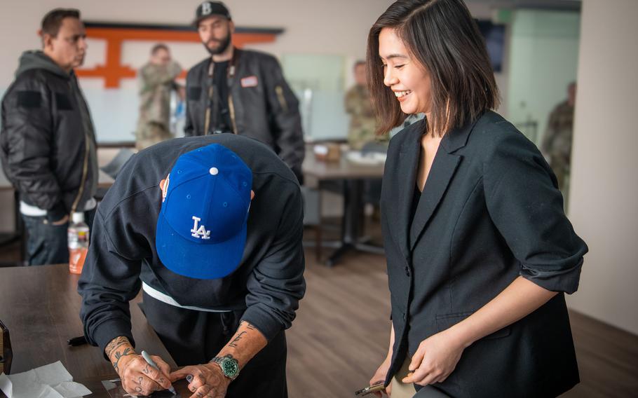 Jo Koy interacts with a community member 