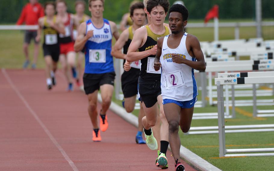 Wiesbaden’s Elijah Smith leads the pack in the boys 3,200-meter race at the DODEA-Europe track and field championships in Kaiserslautern, Germany, ahead of Stuttgart’s Carter Lindsey. Smith won the race in a new DODEA-Europe record of 9 minutes, 44.64 seconds. Lindsey finished second.