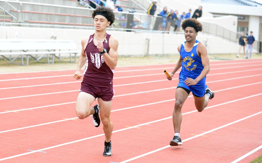 Matthew C. Perry's Tyler Gaines and Yokota's Marcus Woods race for the finish in the anchor leg of the 1,600 relay during Saturday's DODEA-Japan track and field tri-meet. Gaines the the Samurai won in 3 minutes, 53.91 seconds, with Woods and the Panthers second in 3:54.63.