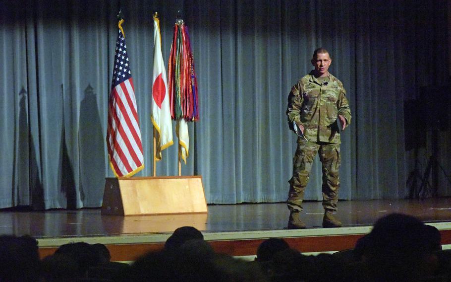 Sgt. Maj. of the Army Michael Grinston answers a soldier's question during a town hall meeting at Kadena Air Base, Okinawa, Monday, Nov. 21, 2022.