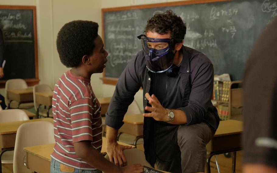 Director Fred Savage, right, who starred in the original “Wonder Years” cast, talks to actor Elisha Williams..