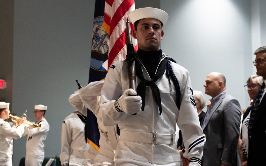 The color guard parades the colors during a decommissioning ceremony for the Los Angeles-class fast attack submarine USS Chicago (SSN 721).