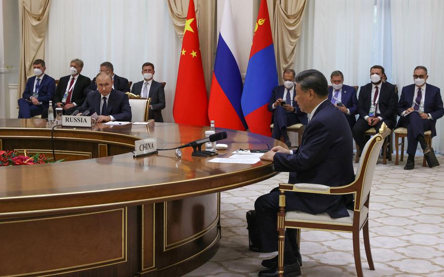 China’s President Xi Jinping, right, Russian President Vladimir Putin, left, at a trilateral meeting (that included Mongolia) on the sidelines of the Shanghai Cooperation Organization leaders’ summit in Samarkand, Uzbekistan, on Sept. 15, 2022. 