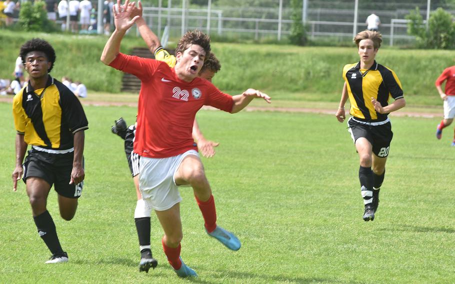 American Overseas School of Rome's Gabriele Ghione heads toward the ground after getting fouled from behind on Tuesday, May 17, 2022, at the DODEA-Europe boys Division II soccer championships at Landstuhl, Germany.