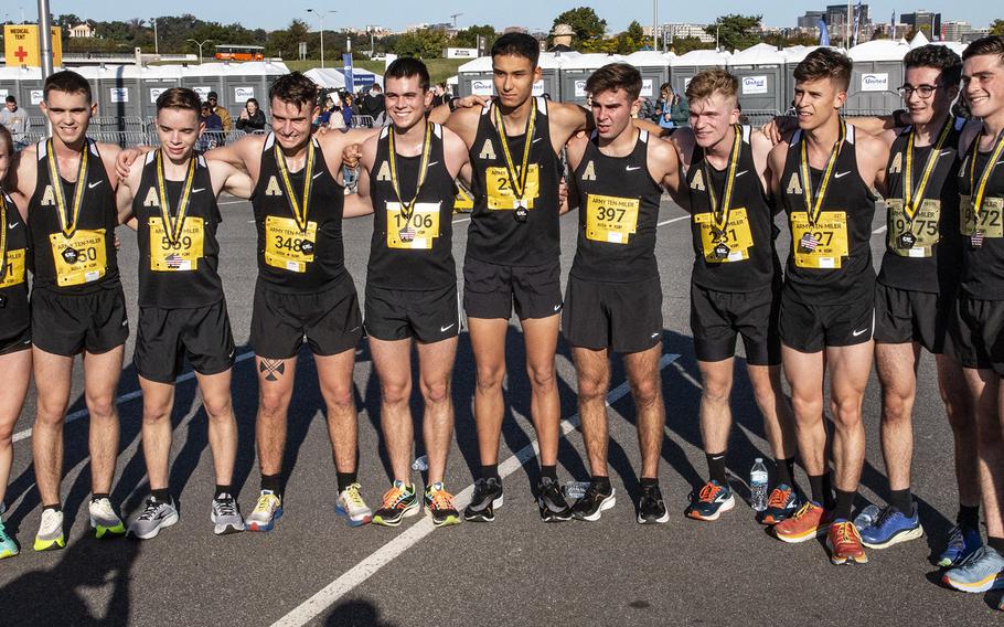 Army runners pose for a photo after the Army 10-Miler Sunday, Oct. 9, 2022 at the Pentagon.