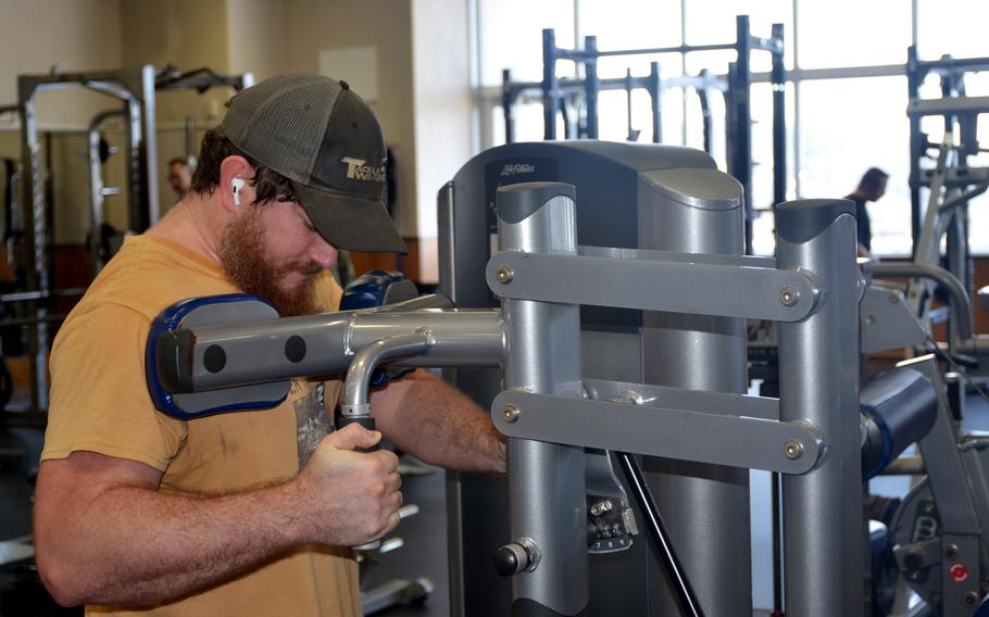 James Kitchen, a civilian machinery mechanic for Puget Sound Naval Shipyard, Wash., works out in the Fleet Recreation Gym at Yokosuka Naval Base, Japan, March 13, 2024. 