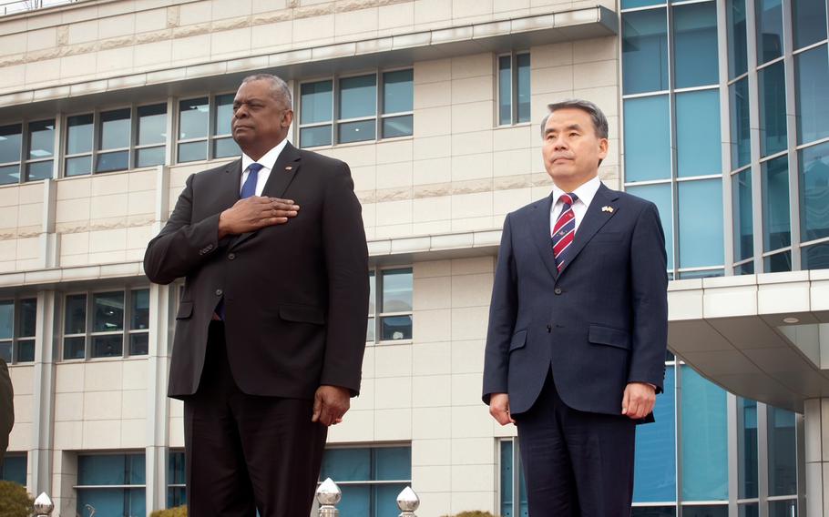 Secretary of Defense Lloyd Austin, left, and his South Korean counterpart, Lee Jong-sup, stand during the U.S. national anthem at the ministry’s headquarters in Seoul, South Korea, Tuesday, Jan. 31, 2023. 