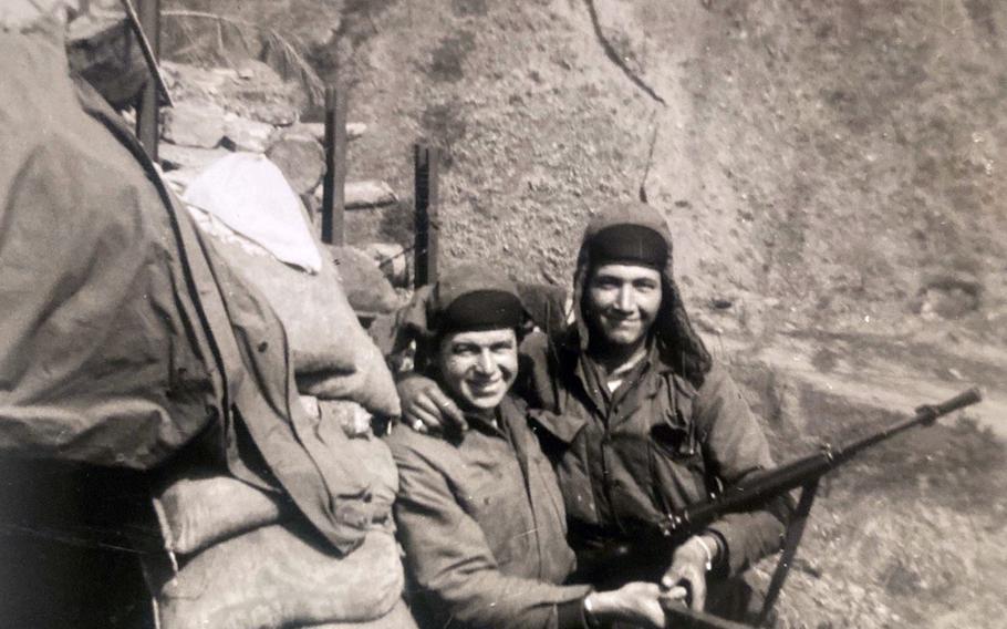 A pair of U.S. soldiers man a sandbagged position on a ridgeline in this undated Korean War photo.