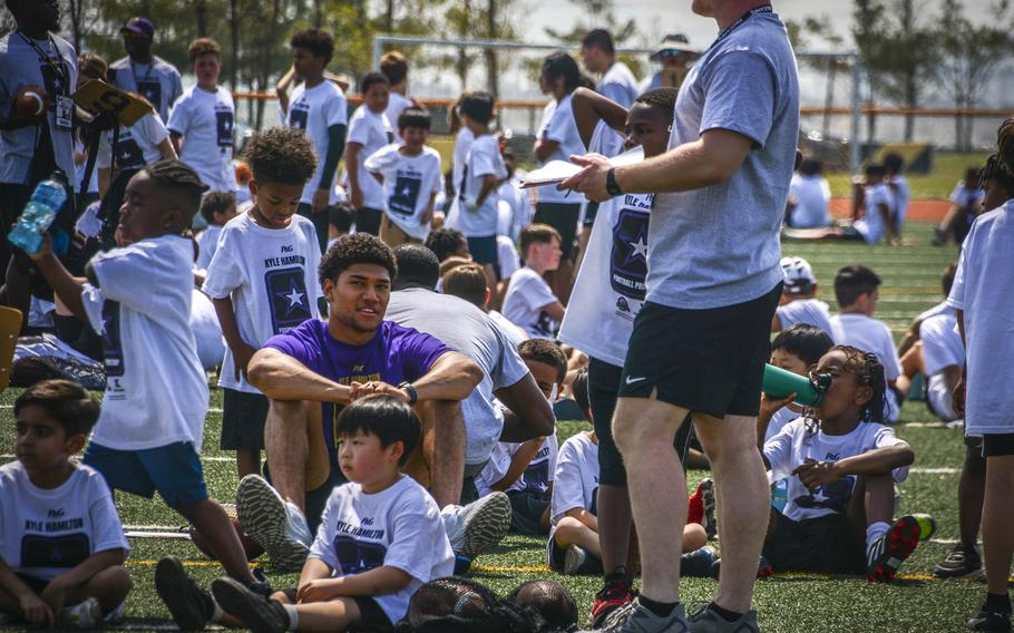 Baltimore Ravens strong safety Kyle Hamilton puts on a football camp for young players at Camp Humphreys, South Korea, April 13, 2024.