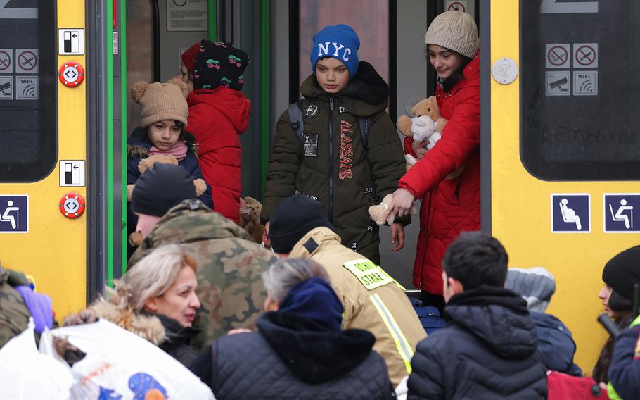 People board a train following their arrival from war-torn Ukraine at the Medyka border crossing on March 9, 2022, in Medyka, Poland. Over 1 million people have arrived in Poland from Ukraine since the Russian invasion of Feb. 24, and while many are now living with relatives who live and work in Poland, others are journeying onward to other countries in Europe. 