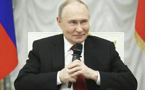 Russian President Vladimir Putin speaks with participants of the Time of Heroes, an educational program for veterans of special military operation, at the Kremlin in Moscow, Russia, Thursday, June 12, 2025. (Sergei Bulkin, Sputnik, Kremlin Pool Photo via AP)