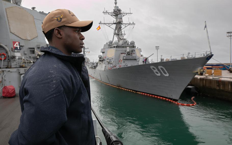 Seaman Dyson Smith mans the rails aboard USS Arleigh Burke as the ship departs from Naval Station Rota in Spain on April 22, 2023. Arleigh Burke is on a scheduled deployment in the U.S. Naval Forces Europe area of operations. Two more Navy destroyers are expected to join four ships already homeported in the country.