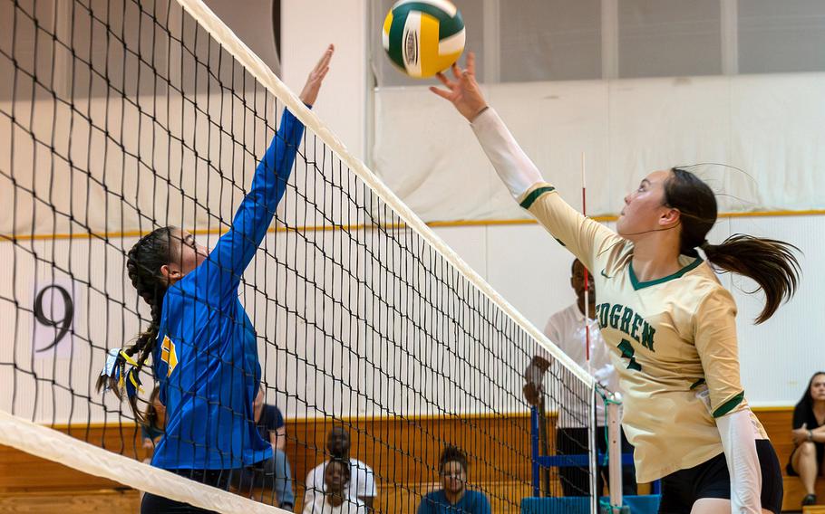 Robert D. Edgren's Milan Bean spikes against Yokota's Coco Jones. The Panthers beat the Eagles in four sets.