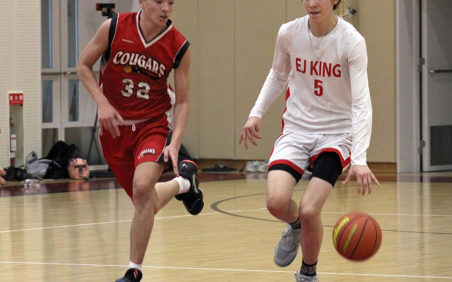 E.J. King's Cameron Reinhart drives upcourt against St. Maur during Friday's Western Japan Athletic Association boys basketball game. The Cobras won 58-34.