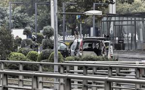 Turkish policemen and security forces cordon off an area next to a car after an explosion in Ankara, Sunday, Oct. 1, 2023.