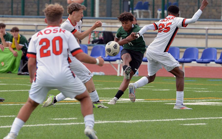 Naples’ Joshua Banks threads the defense to land his shot in the top right corner of the goal on the Wildcats way to beating American Overseas School of Rome 5-2 in the Division II boys final at the DODEA-Europe soccer championships in Ramstein, Germany, May 22, 2025.