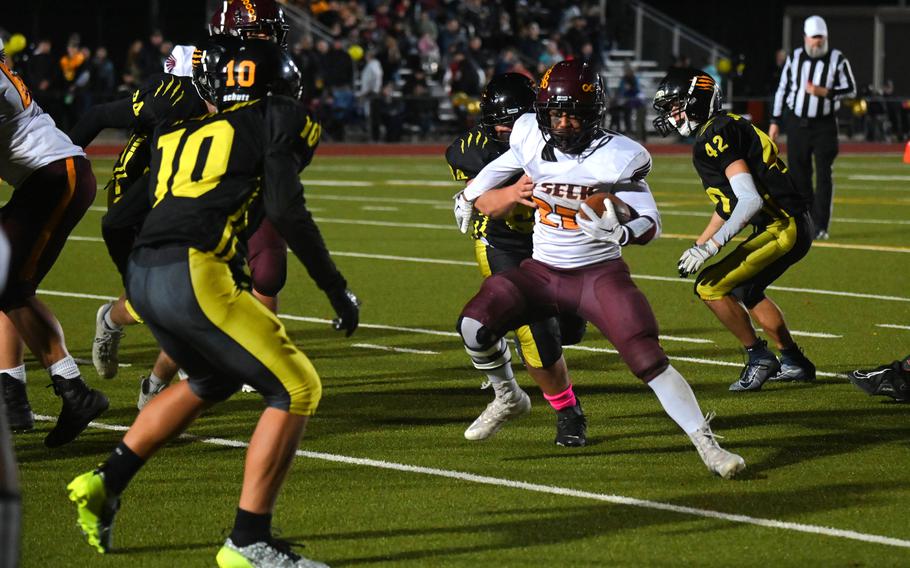 Falcons senior RB Gabe Mallard navigates the Panthers defense during the DODEA Europe Division I championship game against Stuttgart on Oct. 28, 2023, at Stuttgart High School. Mallard accounted for large part of the Falcon’s offense both on the ground and in the air. 