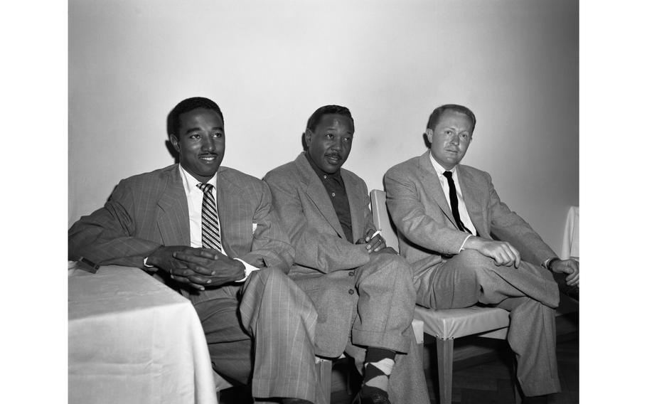 Bassist Ray Brown, trumpetist Roy Eldridge and guitarist Herb Ellis at the Jazz at the Philharmonic reception at the Nikkatsu Hotel, Tokyo, Nov. 3, 1953. Norman Granz and his Jazz at the Philharmonic all-stars — after a wild parade through the streets of downtown Tokyo —  were feted at the Nikkatsu hotel’s sixth-floor banquet room by the public and press.