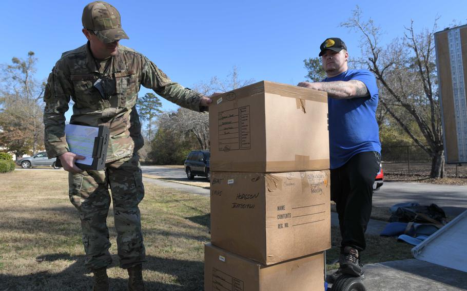 Staff Sgt. Brent Rochette of the 78th Logistics Readiness Squadron inspects shipped items at Robins Air Force Base, Ga., Dec. 15, 2021. The Air Force is halting a program that rewarded experienced airmen who put in four or more years at a stateside base with a job at their preferred base in the continental United States.