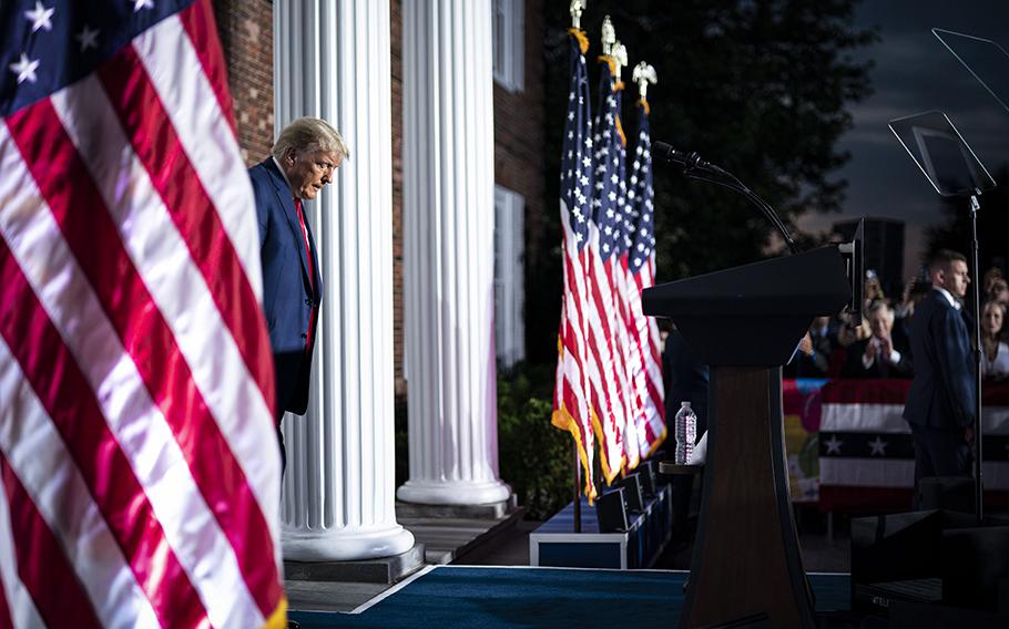 Former president Donald Trump walks out to speak at Trump National Golf Club in Bedminster, N.J., after pleading not guilty to charges in federal court in Miami on Tuesday, June 13, 2023.