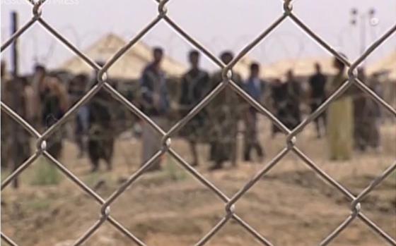 A video screen grab shows prisoners at Iraq’s Abu Ghraib prison.